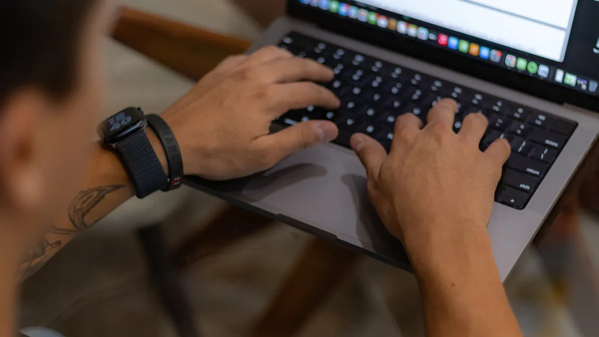 Best content writing software for SEO writers, marketers, and students — Man Writing on a Laptop