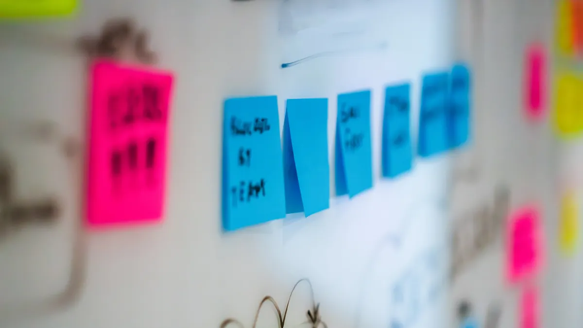 Colorful sticky notes on a wall for topic planning