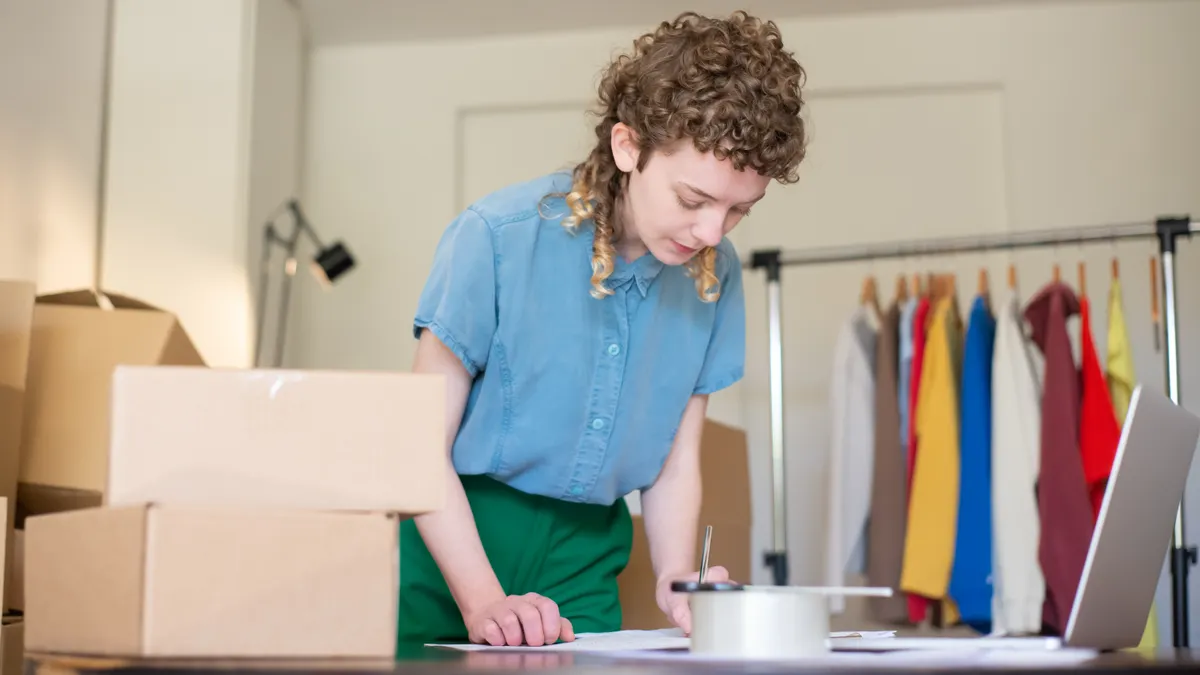 Content writing tools for product descriptions: best options for e-commerce listings — Woman Standing next to a Desk wit
