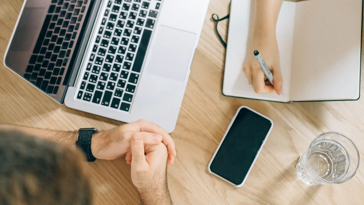 Content writing tools for teams: collaboration, versioning, and approval features compared — Person Holding Pen Writing 