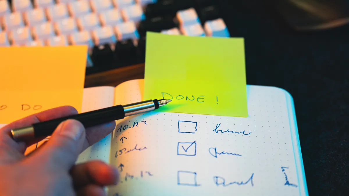Content Writing Tools & Software — The Complete Guide — Hand Writing in Notebook with Checklist and Sticky Note