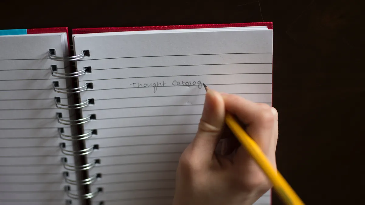 Hand writing in a spiral notebook